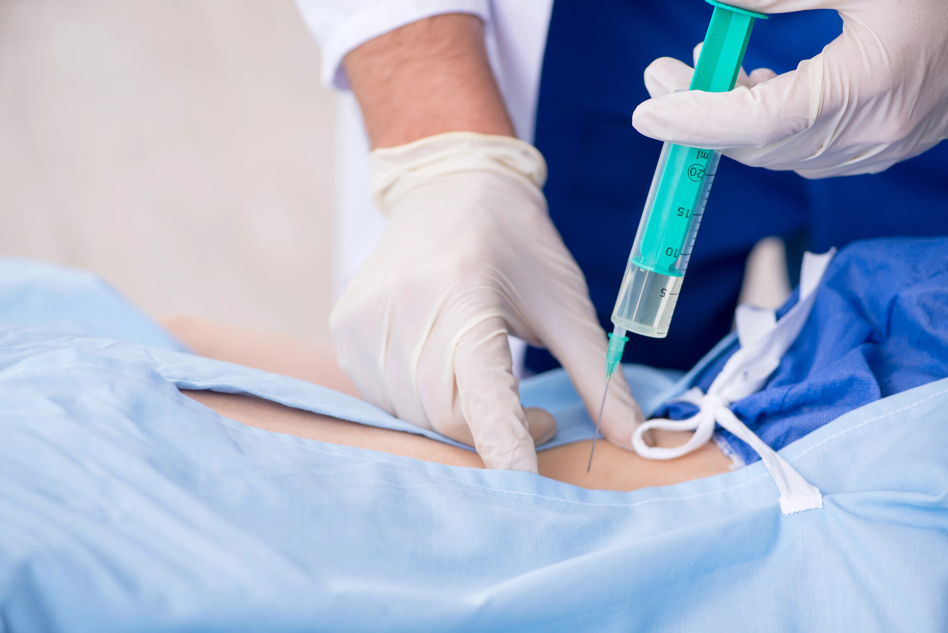 Physician administering an epidural steroid injection