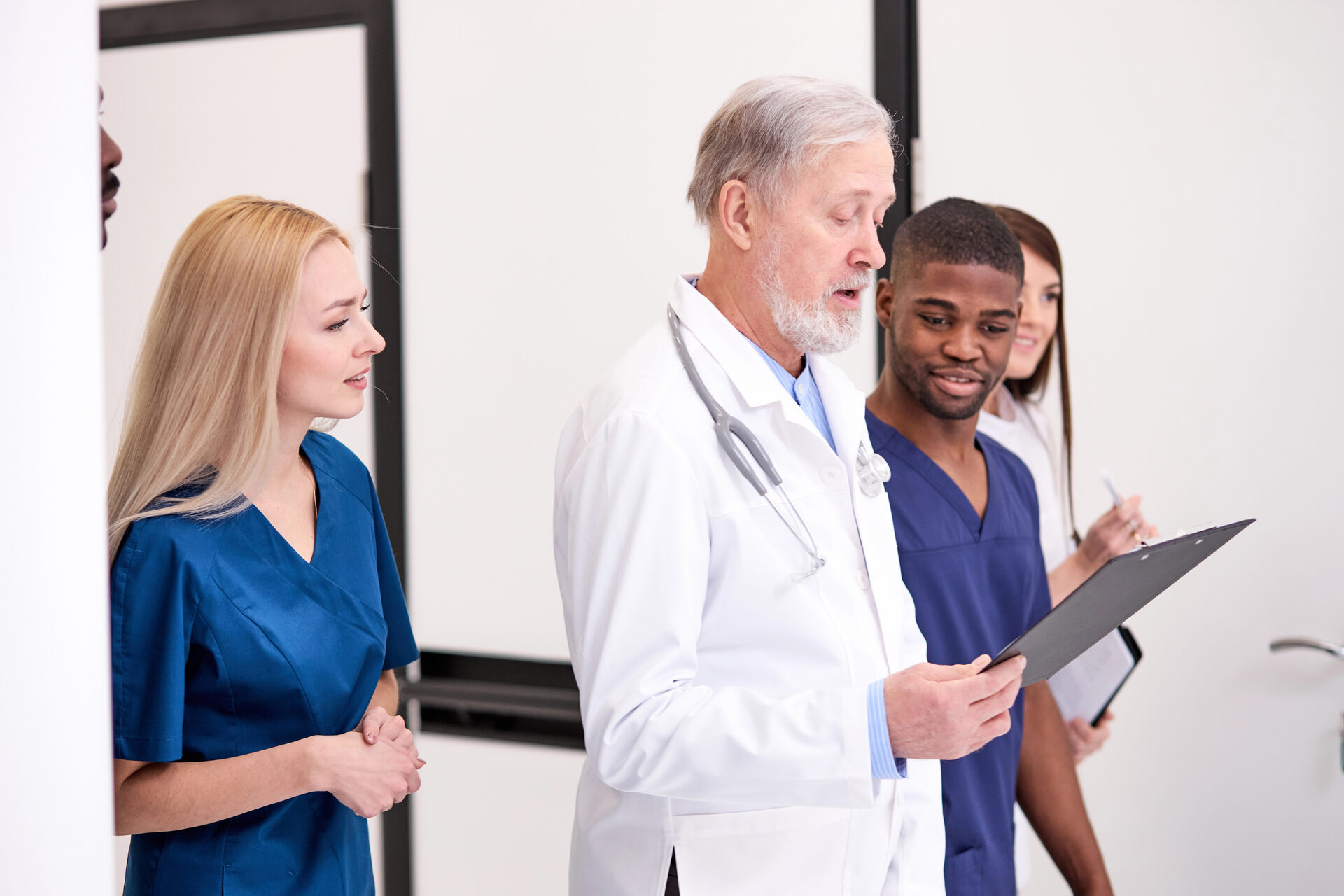 Multidisciplinary medical team collaborating on patient care